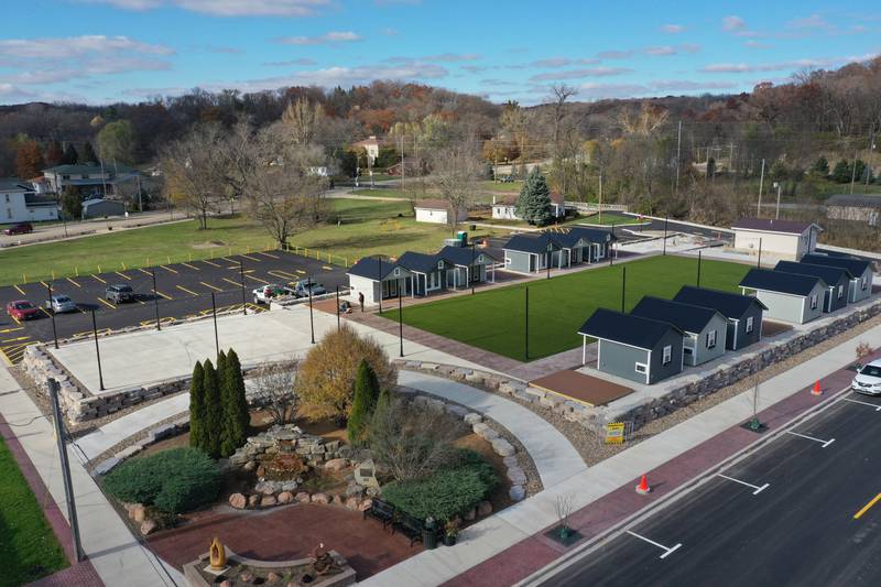 Want to do some holiday shopping at Utica's forthcoming outdoor retail plaza? Mayor David Stewart said he hopes the project will be completed in early to mid December, leaving shoppers a few weeks to buy presents for their families. Crews from the Utica Public Works department are building wooden decking on the corners of the site next to the huts at the Market on Mill, seen here in an aerial photo Tuesday, Nov. 12, 2024.