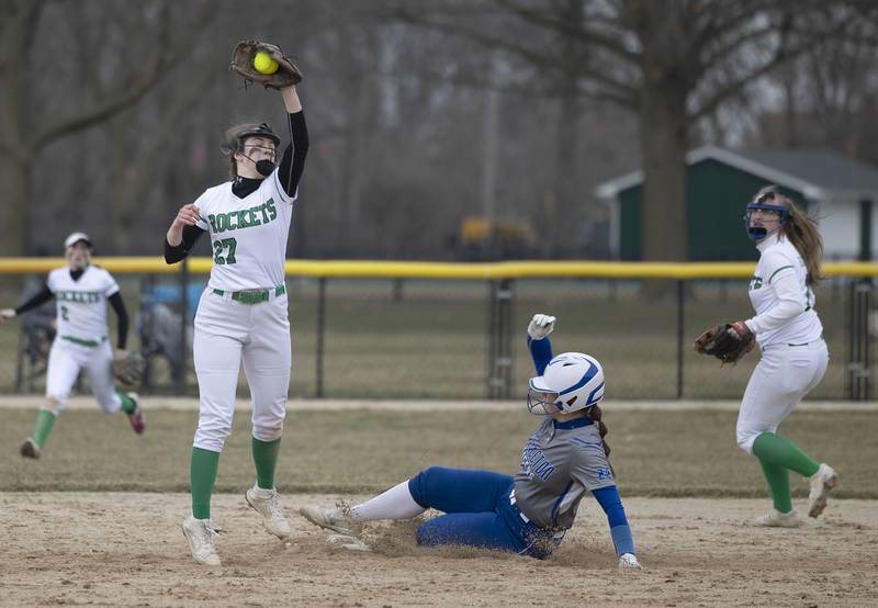 Rock Falls’ Rylee Johnson takes the throw at second as Princeton’s Ellie Harp steals the base Thursday, March 23, 2023.