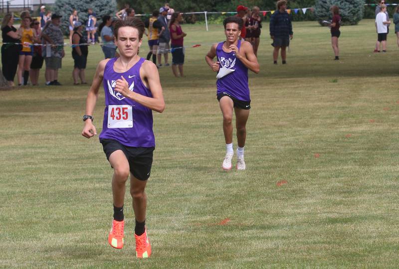 Dixon's Jense Atkinson and Daniel Ramirez compete during the Gary Coates Invitational cross country meet on Saturday, Sept. 13, 2025 at Zearing Park in Princeton .
