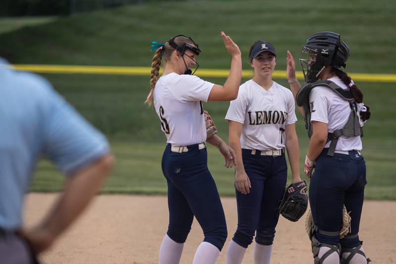(left to right) Mila Mardjetko of Lemont celebrates with teammates Claire Podrebarac and Ania Liptak on Tuesday, June 3, 2025 at Ottawa High School in Ottawa.
