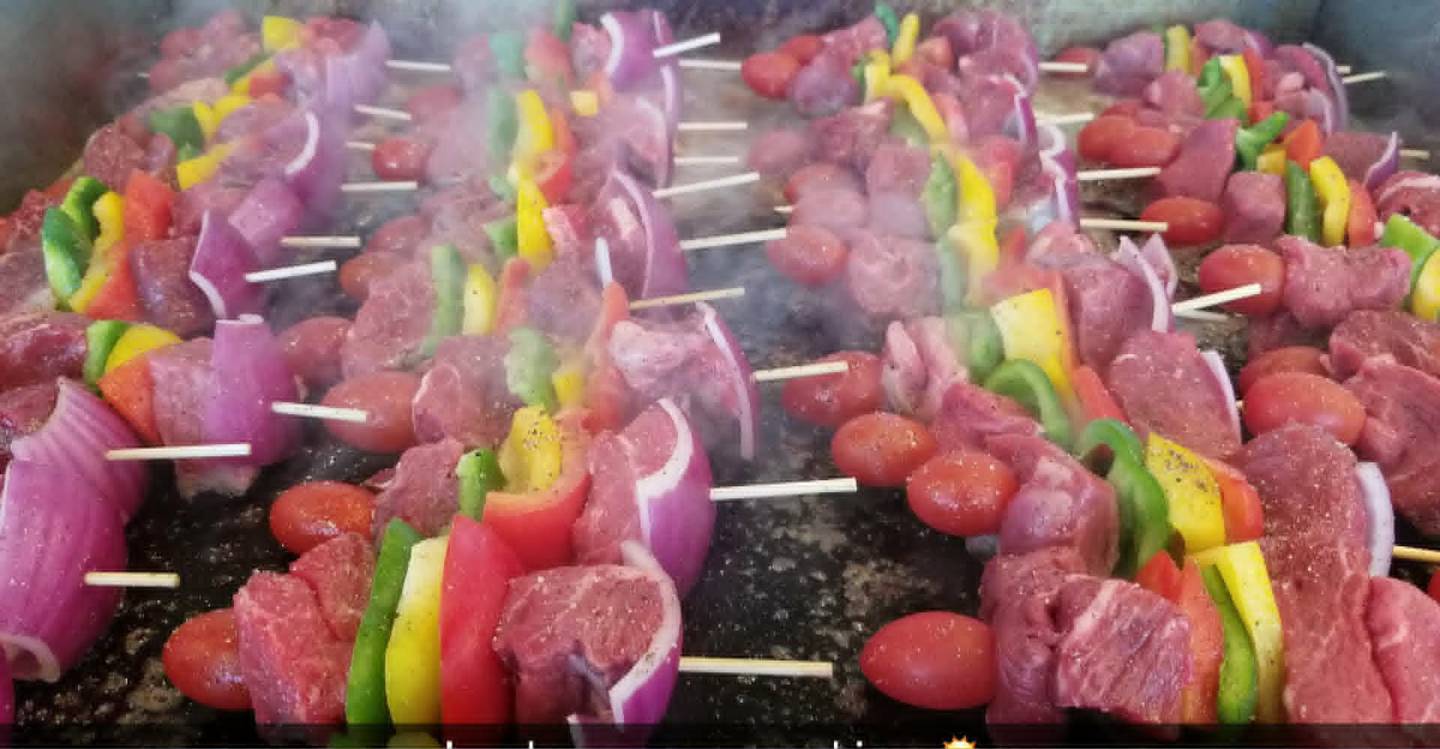 Kids might be more likely to try unfamiliar foods this 2026 Memorial weekend if the foods are presented in a fun way, such as kabobs.