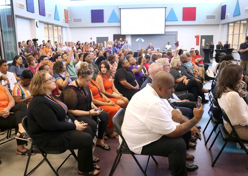 Attendees listen to speakers Friday, Aug. 8, 2025, during the grand opening celebration at the new Mitchell Elementary School in DeKalb.