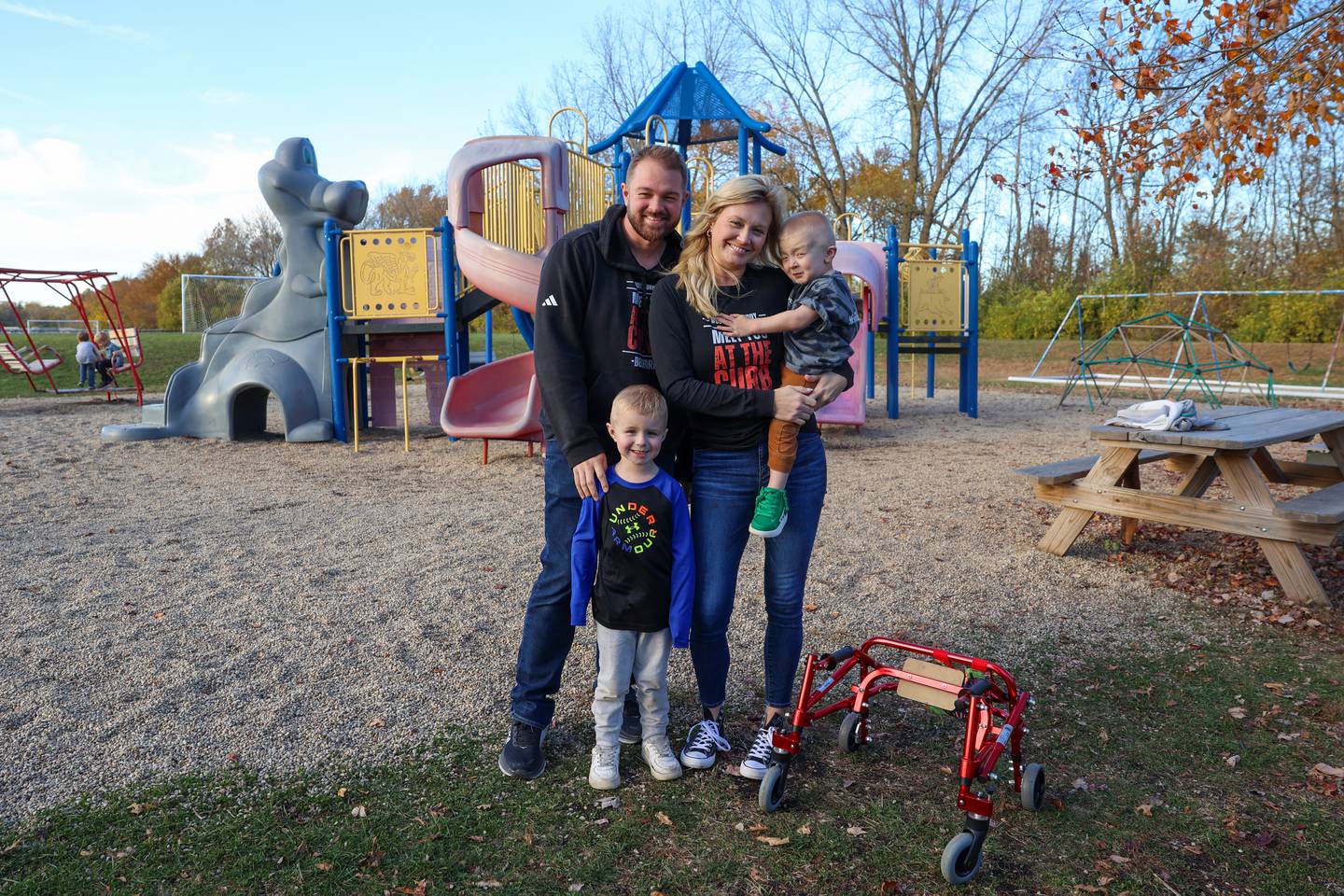 Jesse and Hollie Erickson, stand near Grace Christian Academy’s playground with their sons, Link, 4, left, and Bedford, 2.5, who was born with Schwartz-Jampel Syndrome.
The family is working to bring a new playground to the school next year through Unlimited Play, a nonprofit that builds inclusive playgrounds which chose Bedford’s Playground as the first project in their new “Together We Play” initiative.