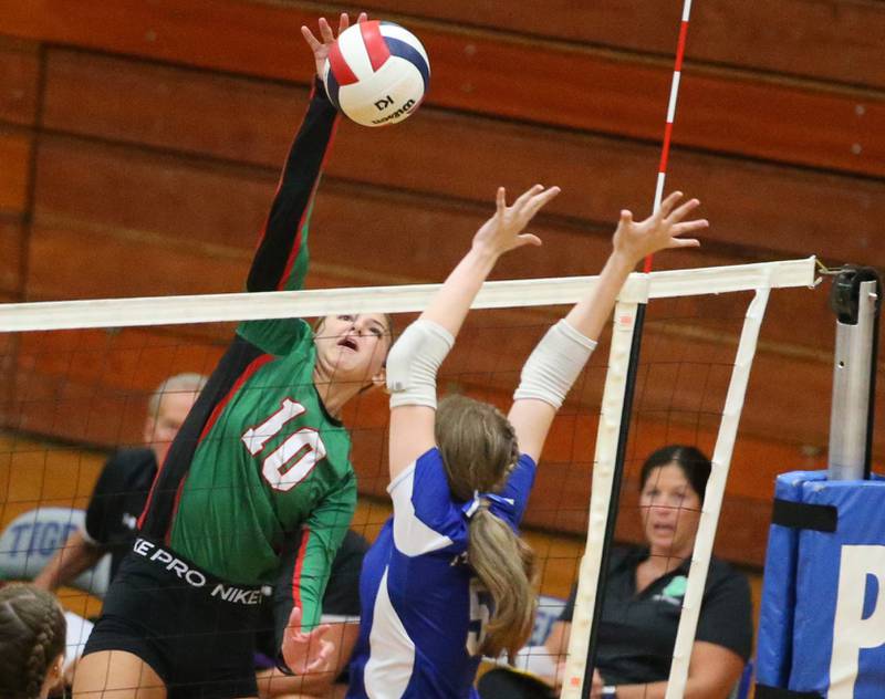 L-P's Kelsey Frederick spikes the ball over Princeton's Karsyn Brucker on Tuesday, Aug. 27, 2024 at Princeton High School.