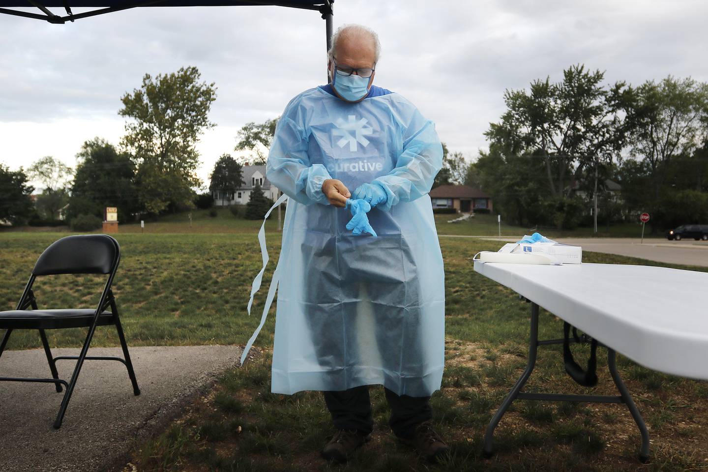 Curative Testing Specialist Tod Schneider suits up to administer weekly COVID-19 testing for D-15 staff on Monday, Sept. 20, 2021 at Hilltop Elementary School in McHenry.