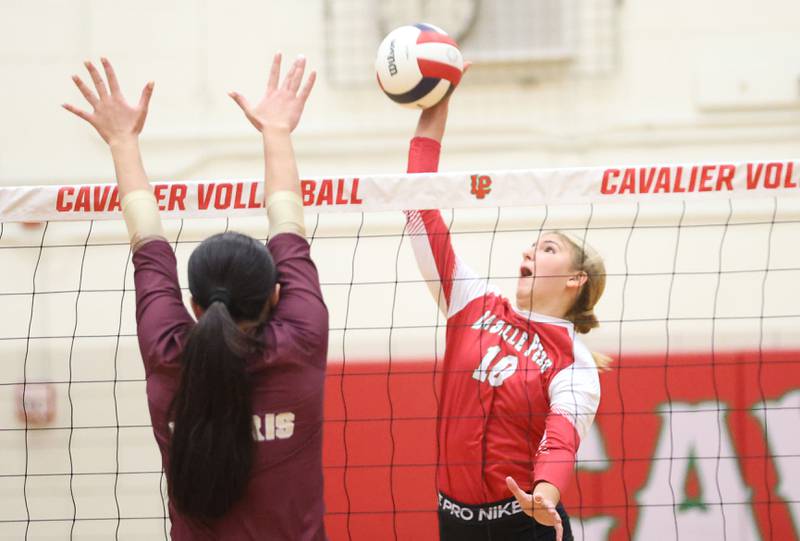 L-P's Keleey Frederick sends a kill past Morris during the Class 3A Sectional semifinal game on Tuesday, Nov. 4, 2025 in Sellett Gymnasium at L-P High School.