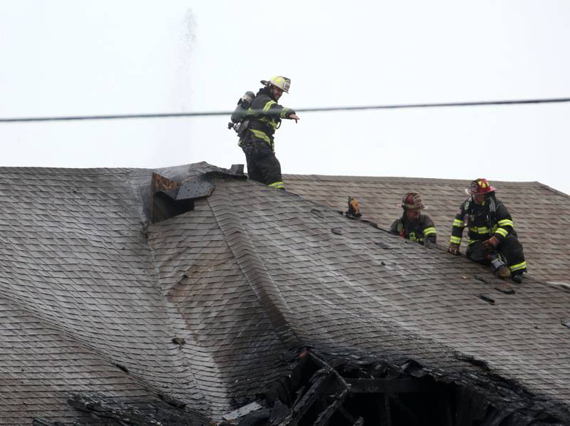 Firefighters work the scene of a structure fire in the 600 block of U.S. Route 6 on Tuesday, April 1, 2025 in La Salle. Fire departments from Peru, La Salle, Utica, Troy Grove, Wallace, Spring Valley and Oglesby were dispatched just before 2:30 to a one-story dublex home.