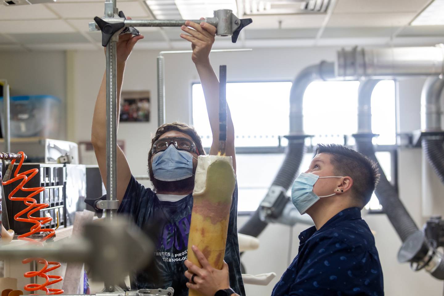 Alisha Brennon, professor of prosthetic technology at Joliet Junior College, assists a student with an OPT project. Brennon, a graduate of JJC's OPT program, has also collaborated with JJC’s veterinary medical technology program to support orthotics and prosthetics for animals. Brennon formerly worked for the Shirley Ryan Ability Lab in Chicago.