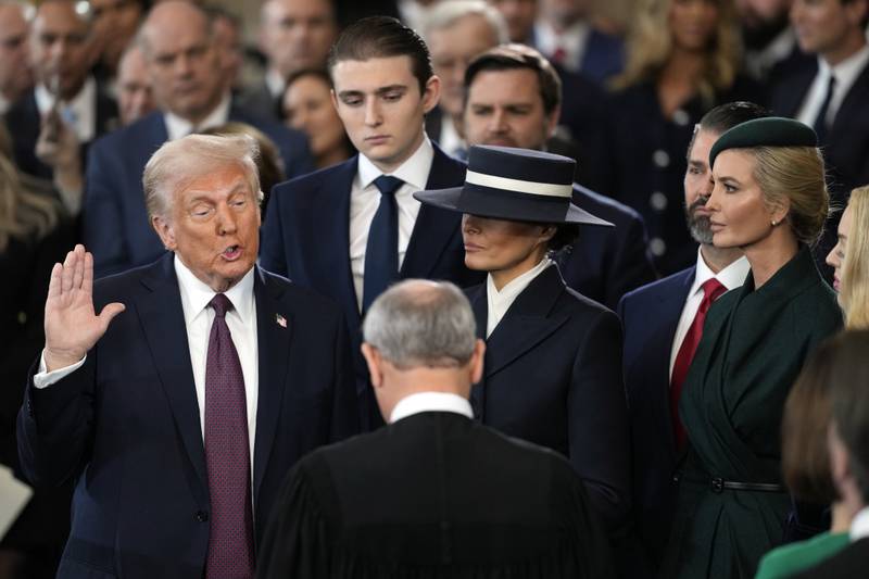 Donald Trump is sworn in as the 47th president of the United States by Chief Justice John Roberts as Melania Trump holds the Bible during the 60th Presidential Inauguration in the Rotunda of the U.S. Capitol in Washington, Monday, Jan. 20, 2025. (AP Photo/Julia Demaree Nikhinson, Pool)