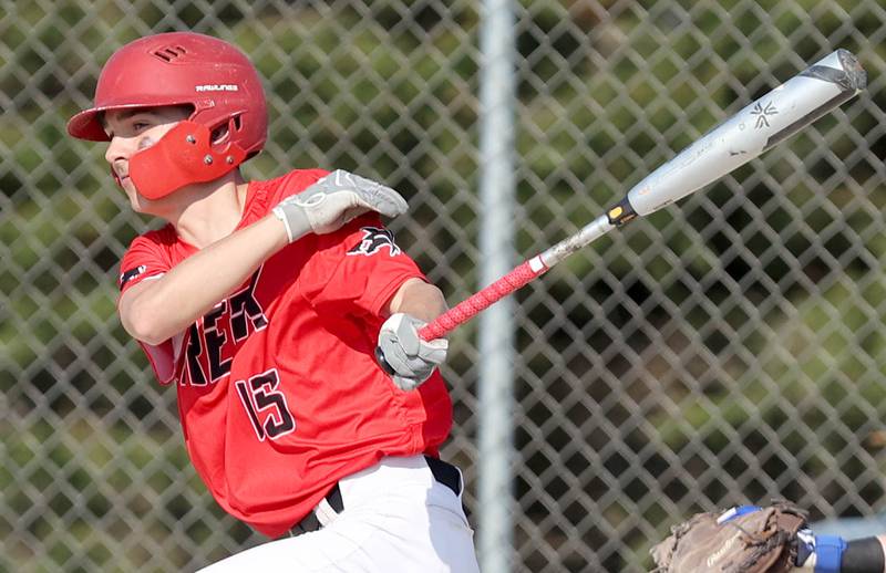 Indian Creek's Kalab Helgesen makes contact Monday, May 9, 2022, during their game against IMSA in Shabbona.