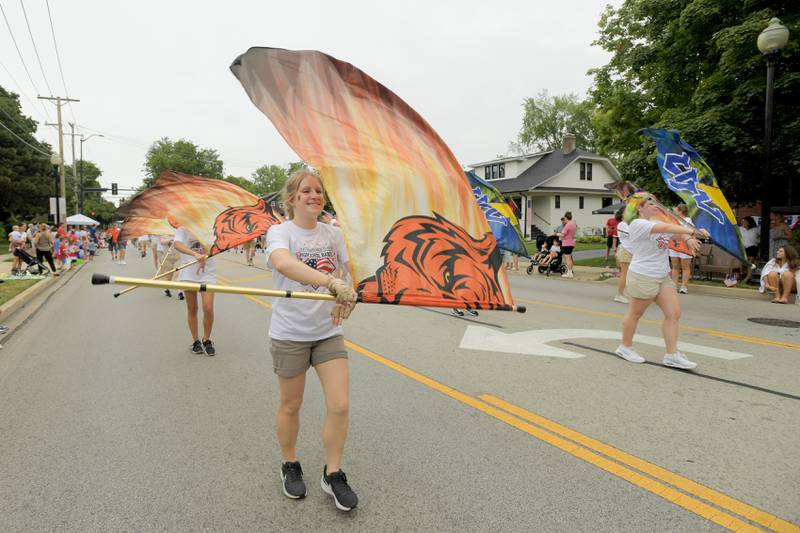 The Wheaton Warrenville South and Wheaton North color guard teams performs in the annual Wheaton Independence Day Parade on Thursday, July 4, 2024.