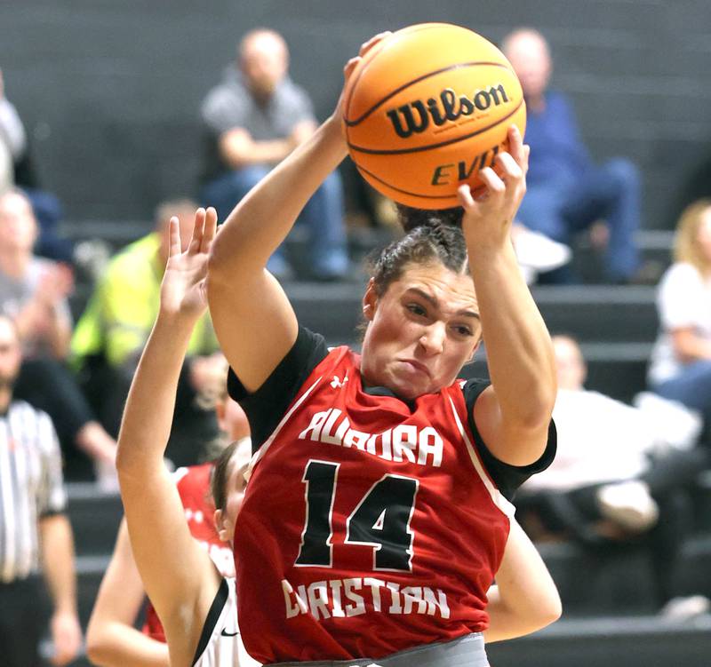 Aurora Christian’s Jada Yizkaya grabs a rebound in front of an Indian Creek defender during their game Monday, Nov. 25, 2024, at Indian Creek High School in Shabbona.