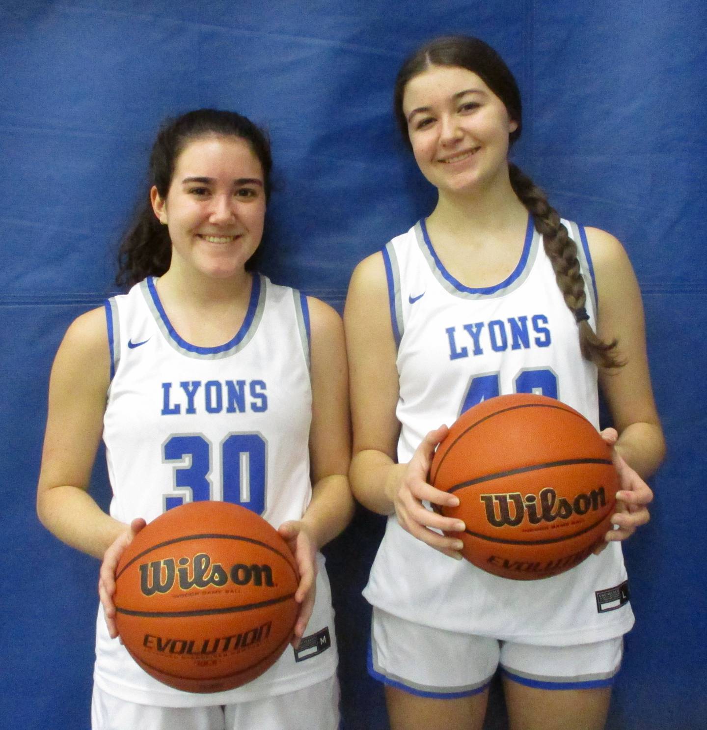Sisters Erin (left) and Emma (right) O'Brien are teammates together this season for the Lyons Township basketball team.