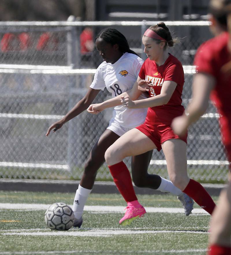Neuqua Valley's Selma Larbi (18) pushes past Batavia's Alexa Schorr Saturday April 8, 2023 in Batavia.