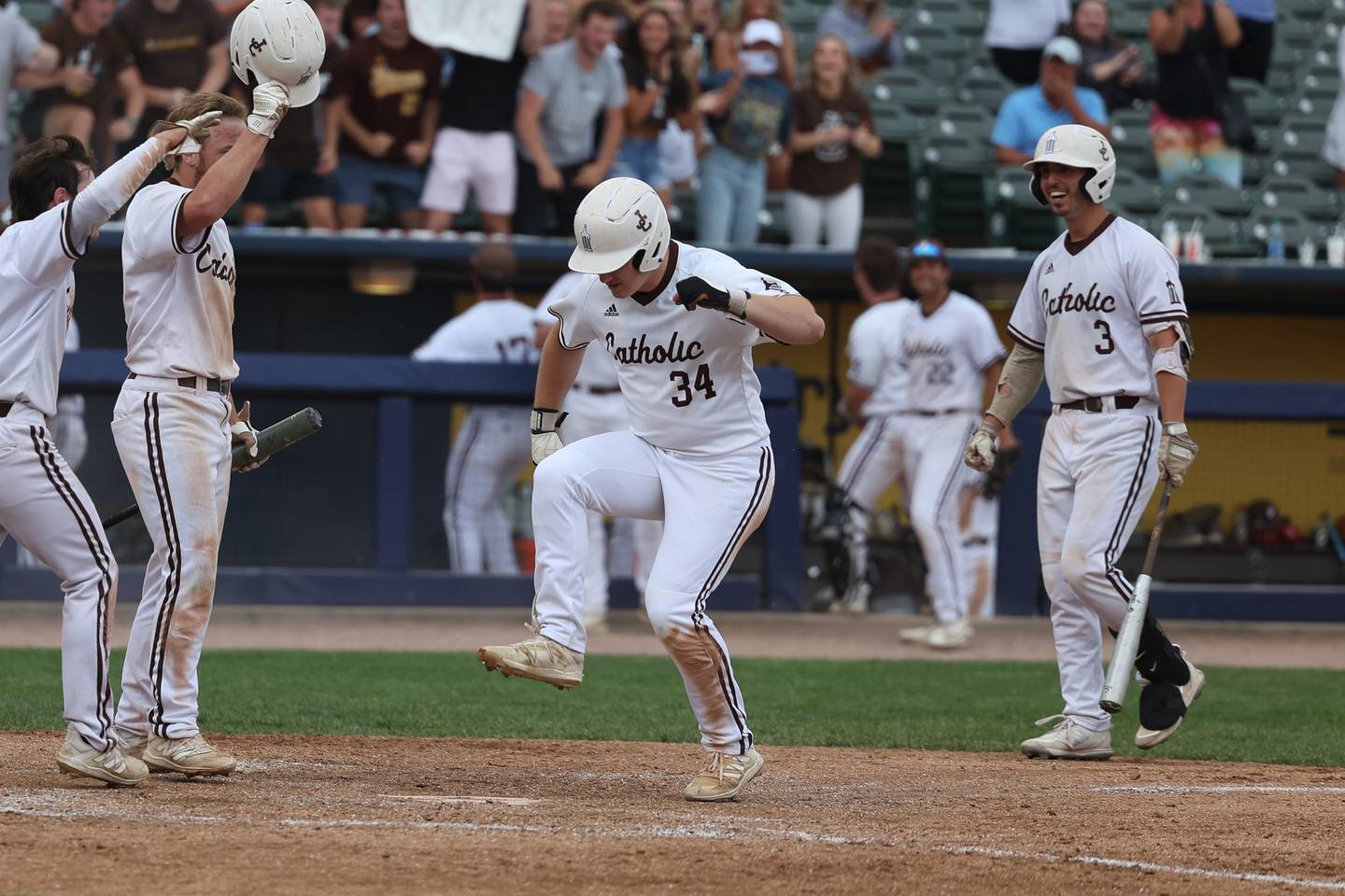 Joliet Catholic’s Jackson Cullen stomps on home plate after his 3 run blast against Richmond-Burton in the IHSA Class 2A championship game. Saturday, June 4, 2022 in Peoria.