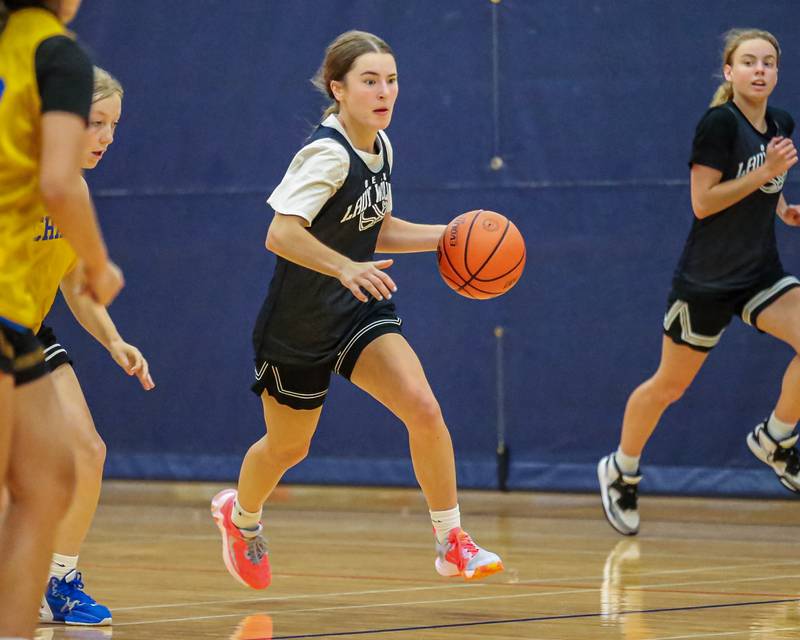 Oswego East's Maggie Lewendowski races down the court at the Oswego Girls Basketball Shootout . June 30, 2023.