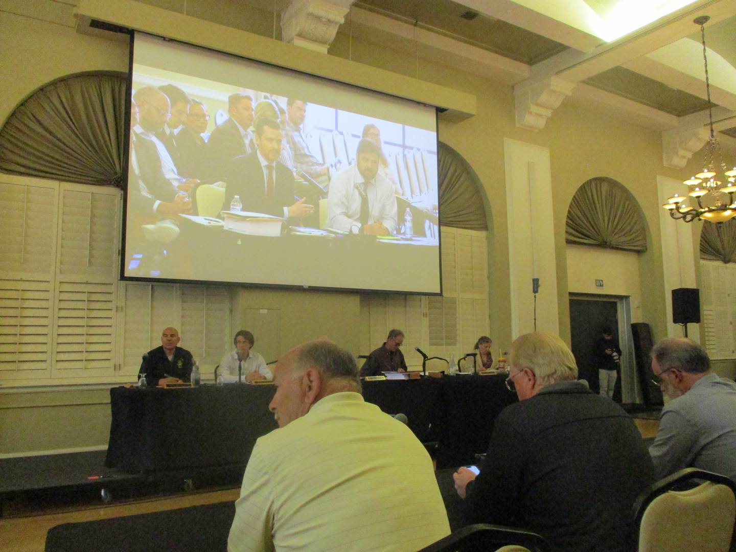 A screen above the Will County Board Planning and Zoning Commission Earthrise Energy representatives answering questions at a public hearing on Tuesday at the Rebaissance Center in Joliet. May 12, 2026