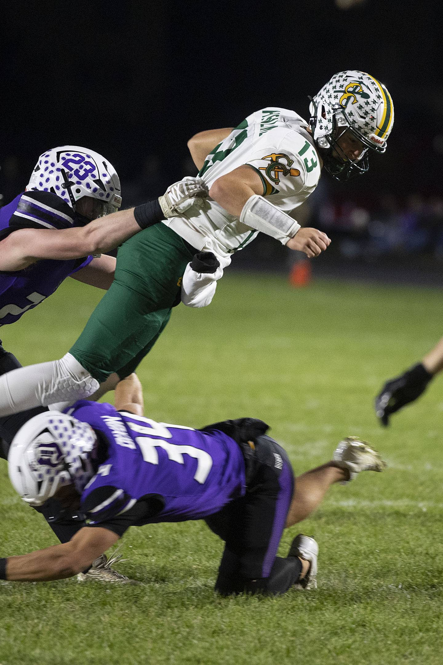Coal City’s Connor Henline leaps to avoid a tackle against Dixon Friday, Nov. 7, 2025.