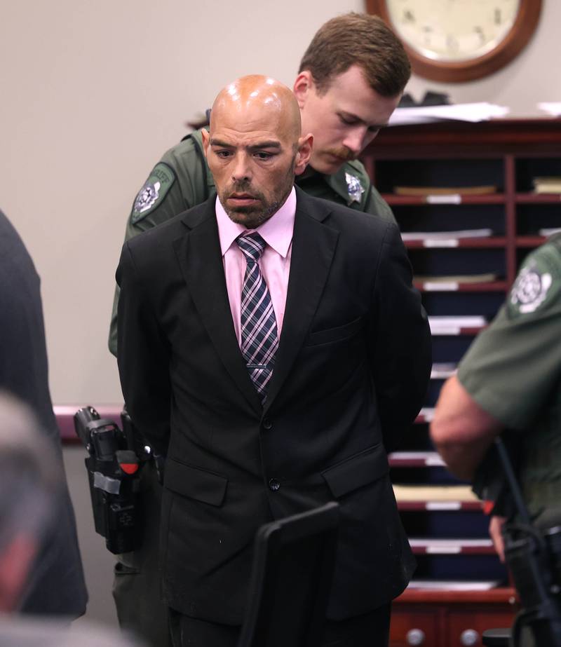 Nathan P. Sweeney is cuffed by an Ogle County sheriff’s deputy Tuesday, Aug. 26, 2025, after his sentencing at the DeKalb County Courthouse in Sycamore. Sweeney received the maximum 14 years for driving under the influence and causing the 2024 crash that killed DeKalb County sheriff’s deputy Christina Musil.