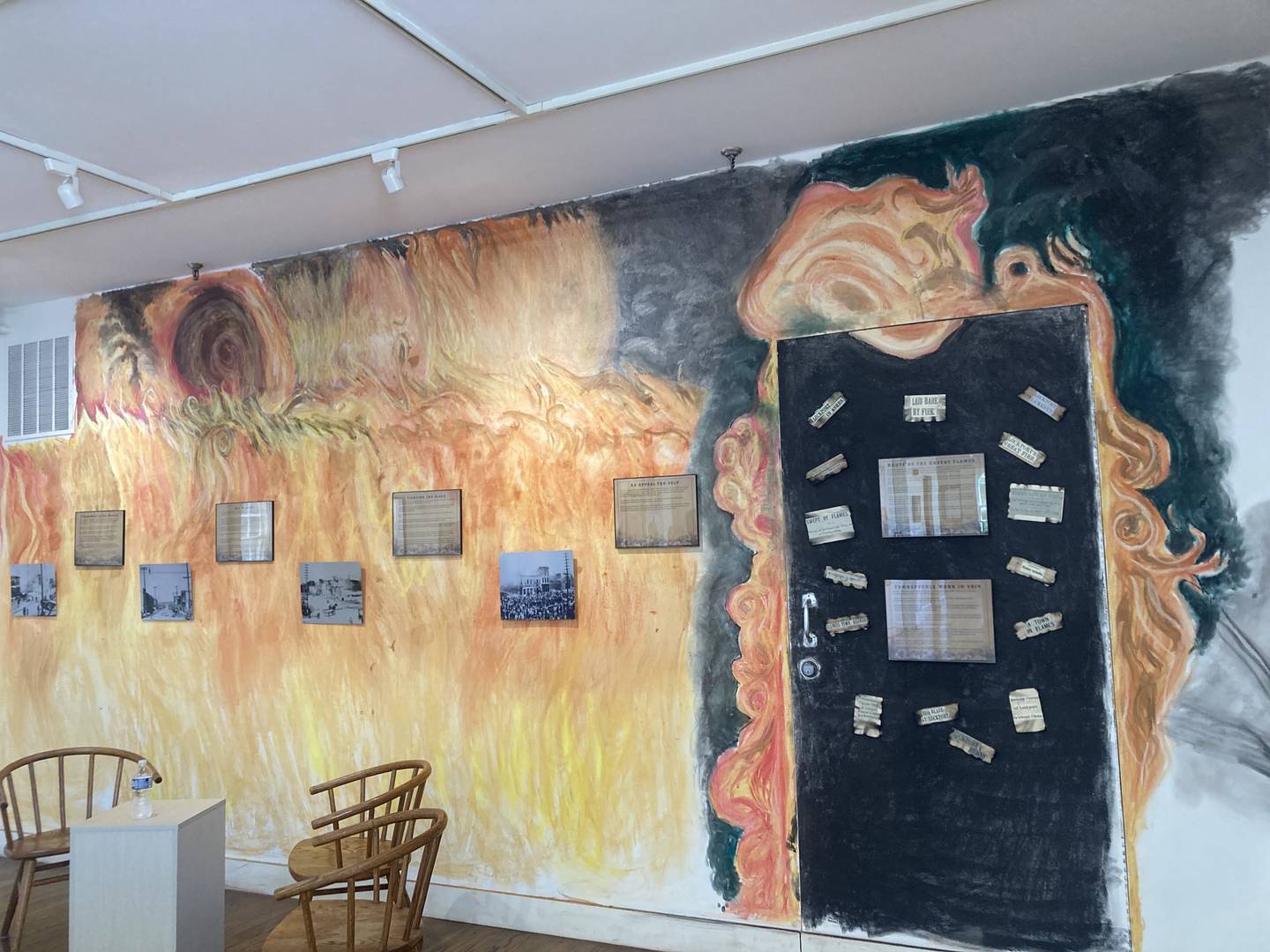 The "fire wall" of the back gallery is drawn to look like smoke and flame billowing from behind a door.