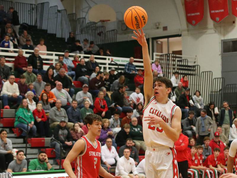 L-P's Nick Olivero lets go of a shot over Streator's Matt Williamson on Tuesday, Jan. 14, 2025 in Sellett Gymnasium at L-P High School.