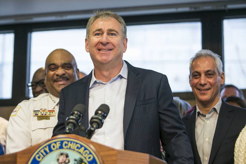 File-This April 12, 2018, file photo shows Chicago Police Supt. Eddie Johnson,left, and Mayor Rahm Emanuel, right, look on as Chicago billionaire Ken Griffin discusses a $10 million donation to reduce gun violence in the city during a press conference in Chicago. The Museum of Science and Industry, Chicago (MSI) on Thursday, Oct. 3, 2019, announced a $125 million gift from the Kenneth C. Griffin Charitable Fund, the largest single gift in the Museum’s history. In recognition of this historic gift, the Museum will become the Kenneth C. Griffin Museum of Science and Industry.  (Ashlee Rezin/Chicago Sun-Times via AP, File)