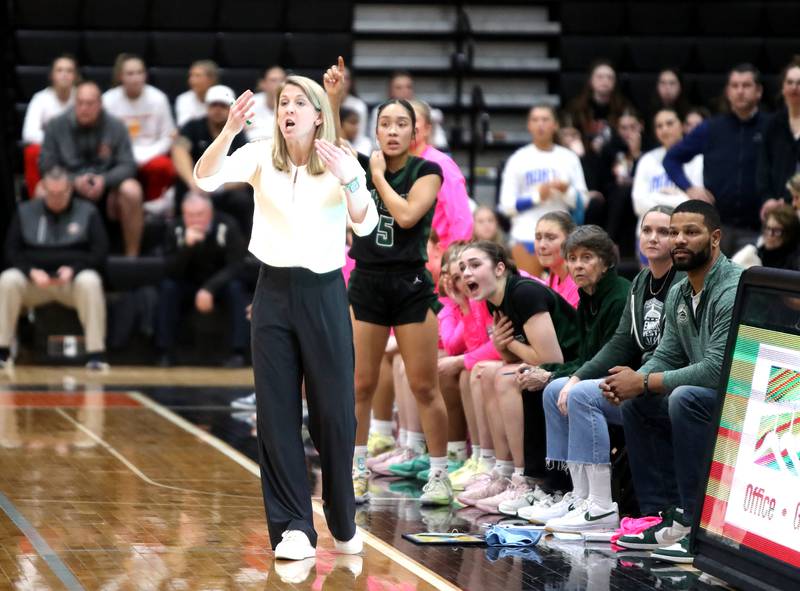 Glenbard West's head coach Kristi Faulkner gestures to her team during a Class 4A St. Charles East Sectional semifinal against St. Charles East on Tuesday, Feb. 25, 2025 in St. Charles.