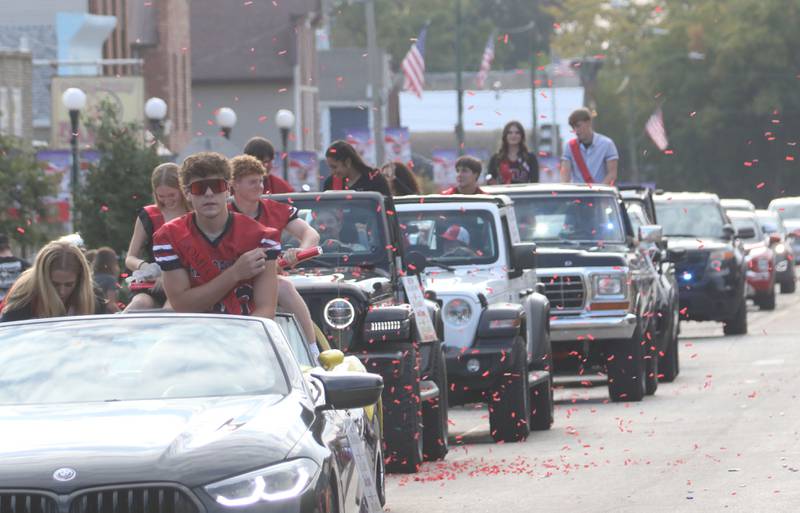 Hall homecoming king candidate Evelyn Bryant and queen candidate Chase Burkart drive through confetti during the Homecoming parade on Thursday, Sept. 18, 2025 downtown Spring Valley.
