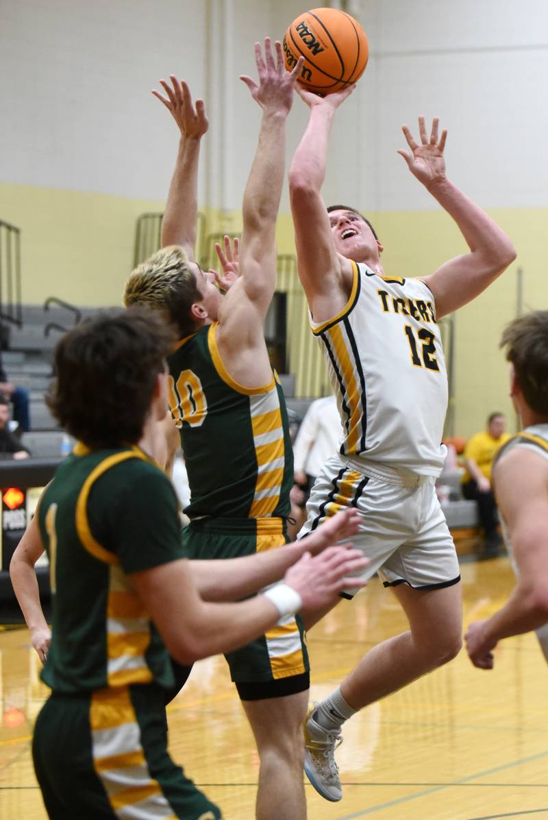 Herscher's Gavin Hull, right, takes a shot as he's fouled by Coal City's Parker Jacovec during a game at Herscher Tuesday, Jan. 27, 2026.