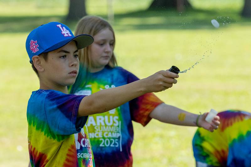 Declan DeRubeis pops water rocket cap during the 23rd annual Carus Summer Science Camp on Friday, July 18, 2025 at St. Bede High School in Peru.
