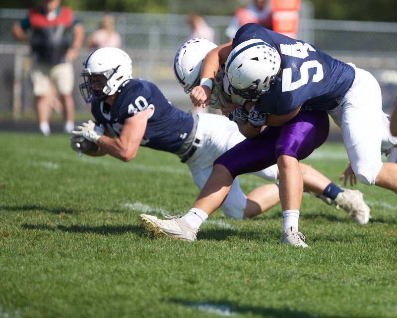 Cary Grove's Logan Abrams goes for gain against Hampshire on Saturday Oct. 5,2024 in Cary.