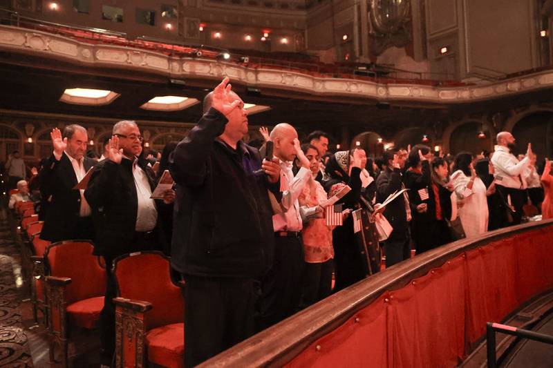 101 applicants for U.S. citizenship from 27 countries take the Oath of Allegiance during the Special Naturalization Ceremony held at the Rialto Square Theatre in downtown Joliet on Tuesday, April 23, 2024.