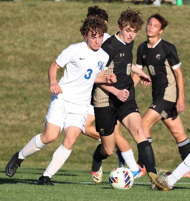 Burlington Central's Zach Batani (left) and Sycamore's Tyler Hiland fight for possession Wednesday, Oct. 23, 2024, during their Class 2A Sycamore Regional semifinal.