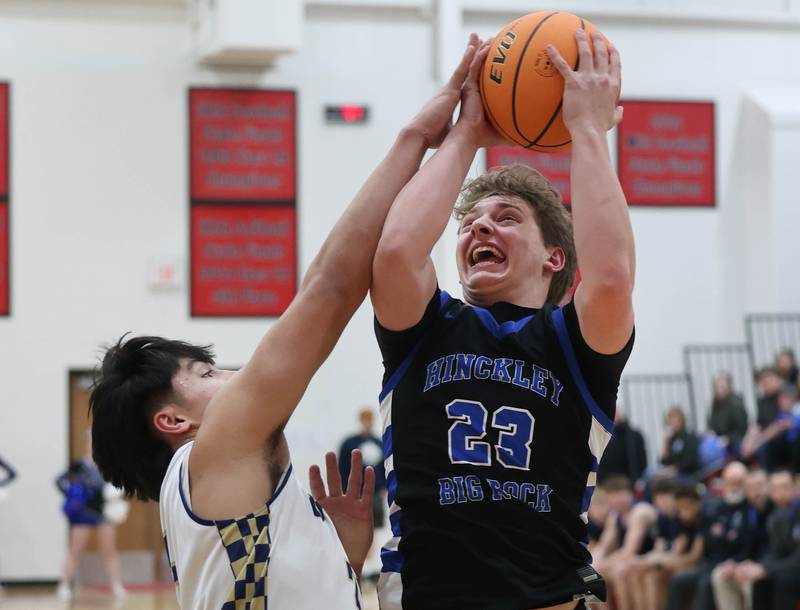 Hinckley-Big Rock's Luke Badal is fouled by Marquette's Blayden Cassel Tuesday, March 3, 2026, during their sectional semifinal matchup at Amboy High School.