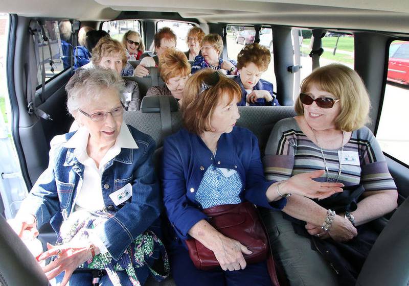 Left to right: Myrt Novak of Willowbrook, Jean Spatol of Hawthorn Woods and Cheryl Vandendolder of Hawthorn Woods have front row seats for the Geneva History Museum's van tour around historic downtown Geneva on Thursday.