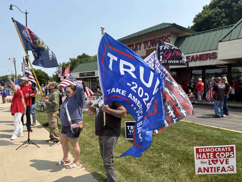 People rally outside the Trump and Truth Store in Huntley May 31, 2025.