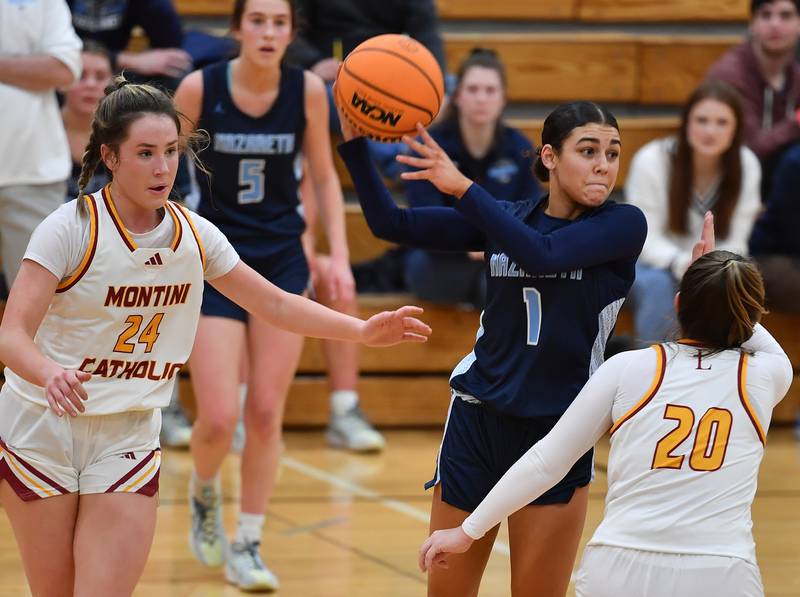 Nazareth’s Allia Von Schlegell passes while double teamed by Montini’s Peyton Farrell (24) and Lily Spanos during a Coach Kipp Hoopsfest game on January 20, 2025 at Benet Academy in Lisle.