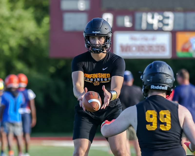 Reed-Custer's Jake Mcpherson takes the snap during the Veterans Assistance Commission meeting July 12, 2022