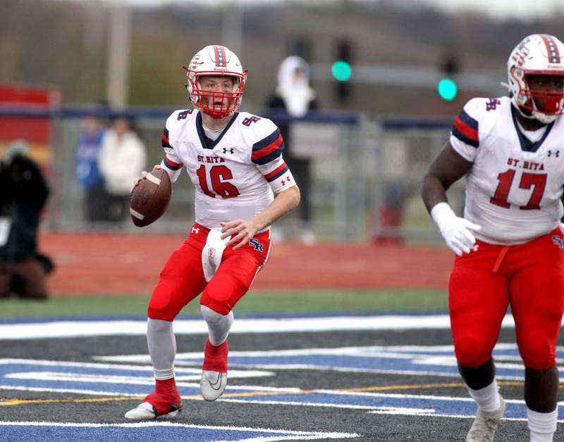St. Rita's Jett Hilding (16) looks to throw the ball during their 7A quarterfinal game against St. Charles North in St. Charles on Saturday, Nov. 12, 2022.