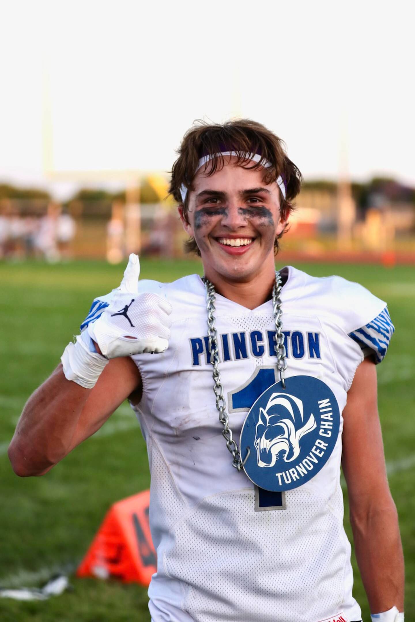 Princeton's Brady Byers wears the turnover chain after making a 30-yard touchdown return off an interception in Friday's game at Rockridge.