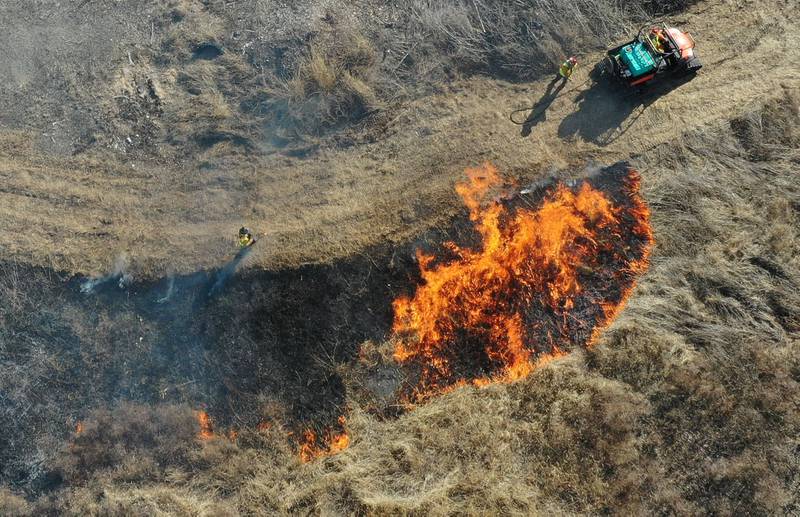 Crews from Semper FI Land Services. along with the help from the Illinois Department of Transportation, conduct a controlled burn at Deer Pit Prairie near the intersection of Interstate 39 and Illinois Route 251 on Monday, Feb. 10, 2025 near Oglesby. The burns are designed to clear out invasive plants and encourage the growth of native prairie vegetation. Other locations that IDOT has another scheduled future burns are Indian Boundary Prairie near Ohio in Bureau County.