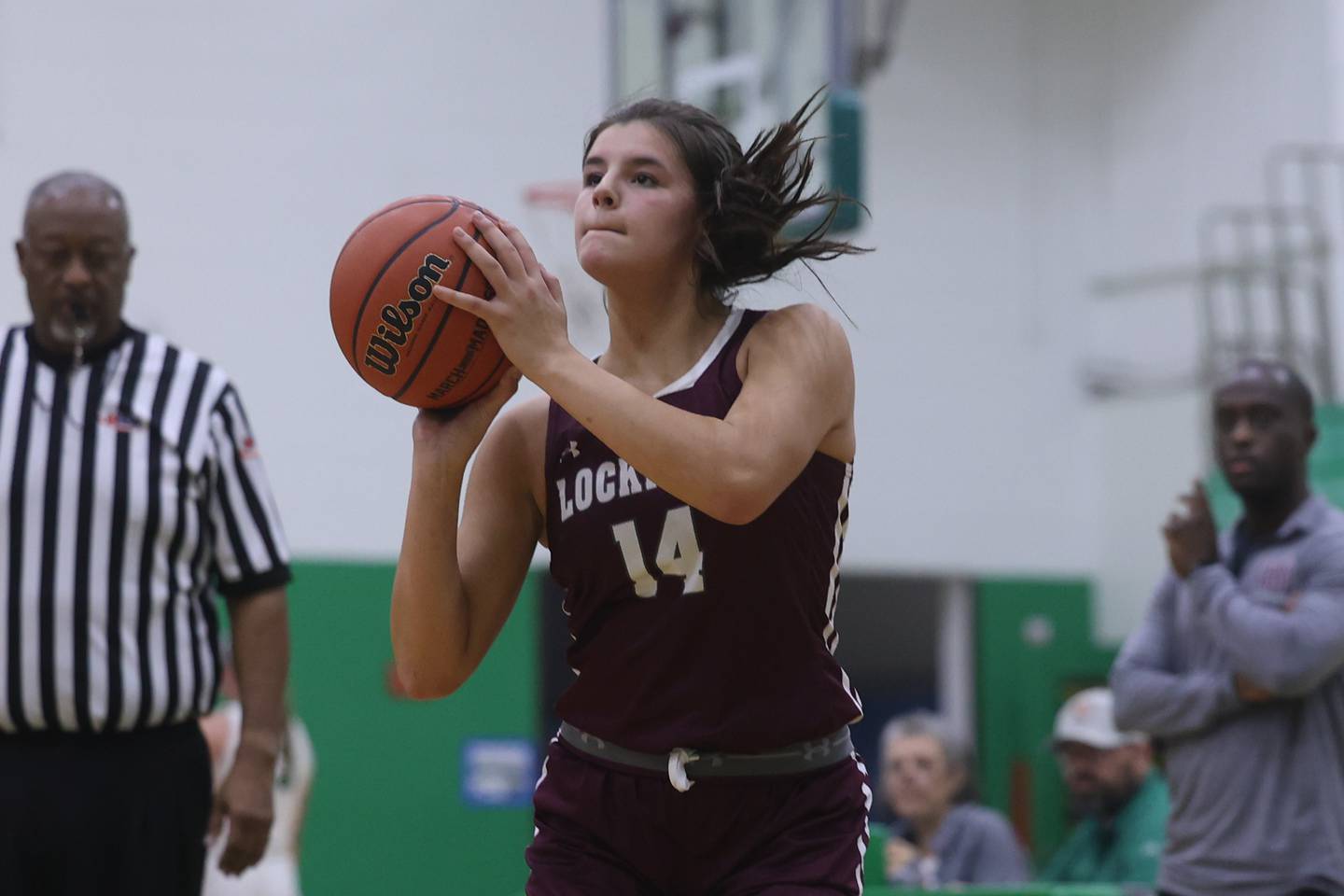 Lockport’s Veronica Bafia puts up the three point shot against Providence.