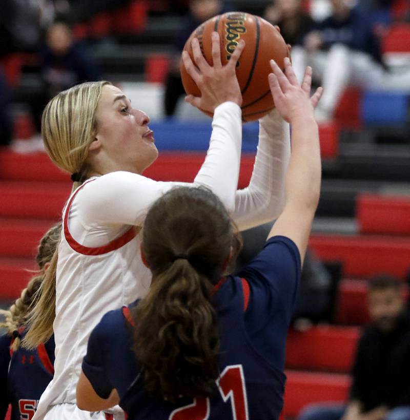 Huntley’s Anna Campanelli shoots the ball over South Elgin’s Molly Stahl on Tuesday, Nov. 21, 2023, during a basketball game in the Dundee-Crown High School Girls Thanksgiving Tournament in Carpentersville.