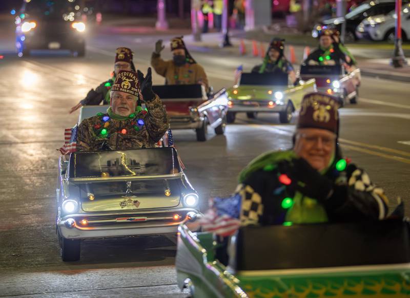 The West Suburban Shriners Club drive their mini cars during the annual Holly Days Frosty & Friends Parade in Westmont on Saturday, December. 7, 2024.