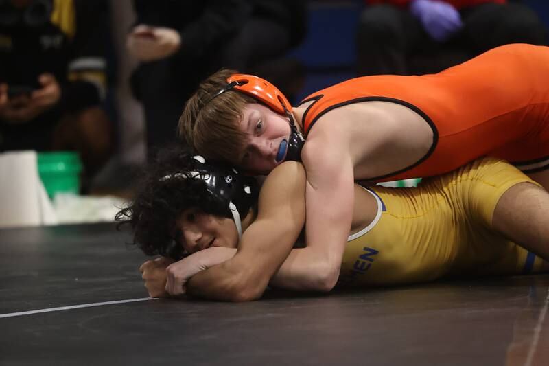 Minooka’s Mason Vogt works over Joliet Central’s Yadiel Colon in the Southwest Prairie Conference 106 pound Championship at Joliet Central on Saturday, Jan. 20th, 2024.