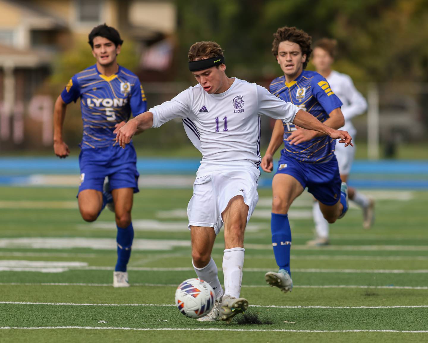 Downers Grove North's Jimmy Harkness (11) races down the pitch during Class 3A Lyons Regional final soccer match.  Oct 21, 2023.