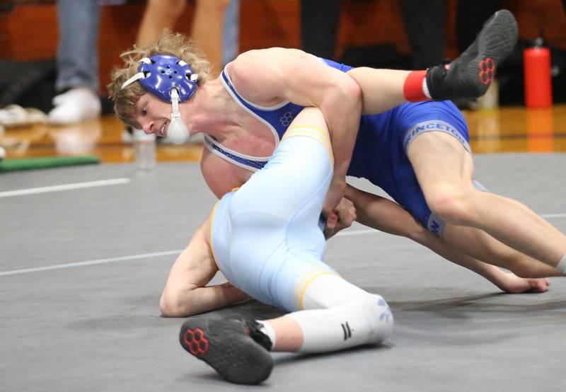 Princeton's Agustus Swanson wrestels Marquette's Connor Eggers during the Class 1A Regional meet on Saturday, Jan. 31, 2026 at Princeton High School.