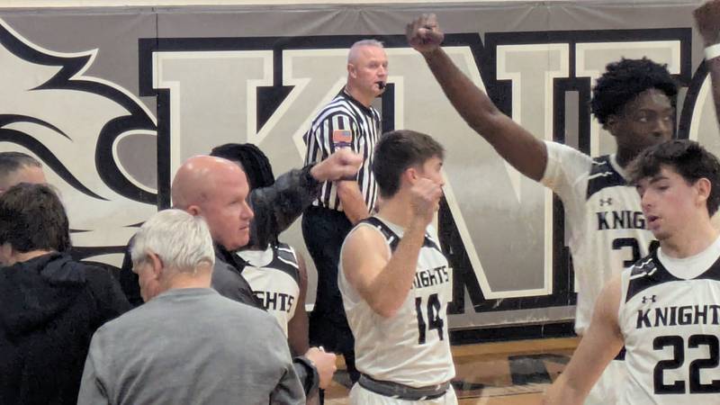 The Kaneland boys basketball team breaks a huddle in the first half of a 57-49 win against Marmion on Saturday, Dec. 7, 2024.