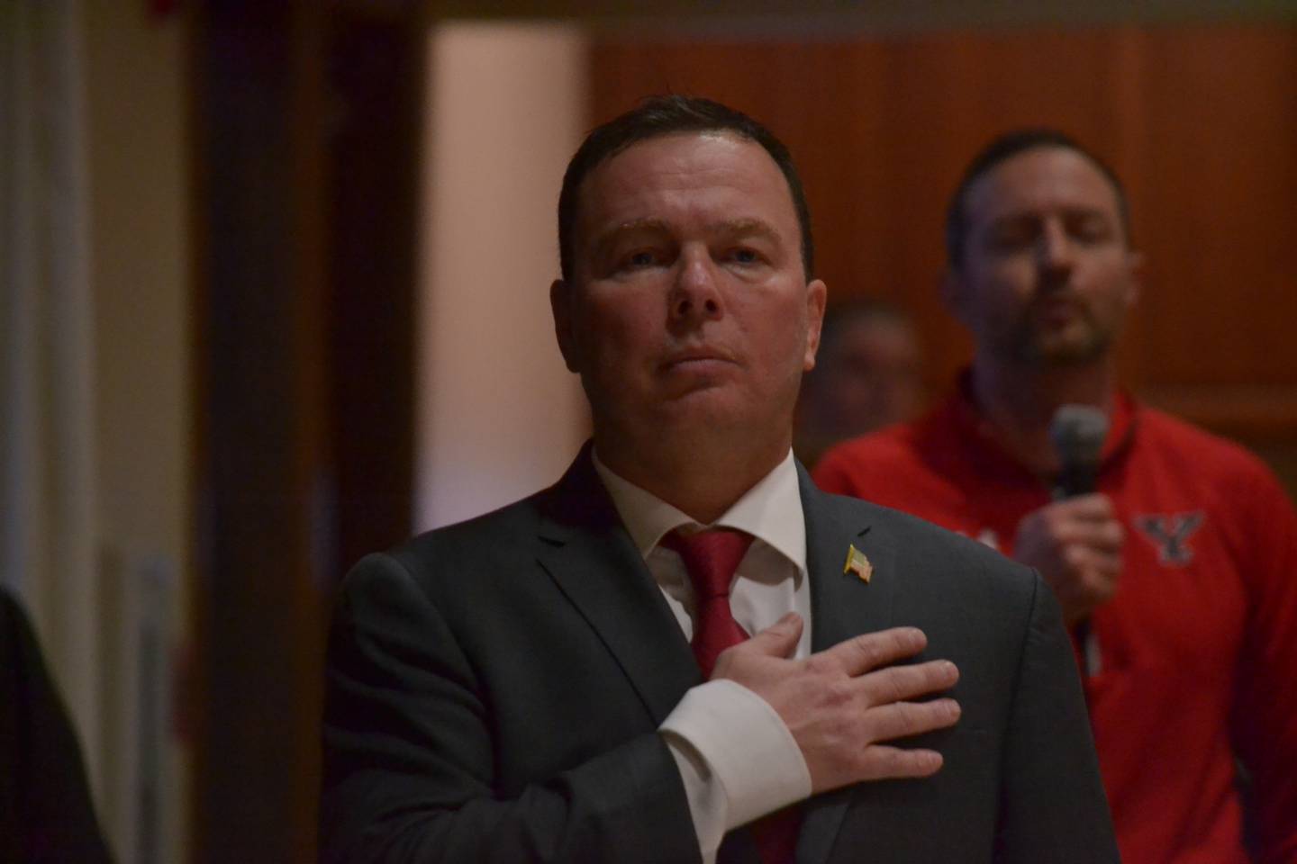 Republican congressional candidate Jack Lombardi says the Pledge of Allegiance prior to a debate on April 20, 2022 in Yorkville. (Alex Ortiz -- aortiz@shawmedia.com)