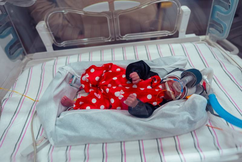 One of Minnie Mouse triplets at Silver Cross Hospital's NICU unit on Halloween 2025.